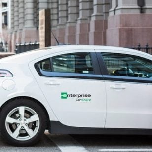 The back of a white Enterprise CarShare vehicle