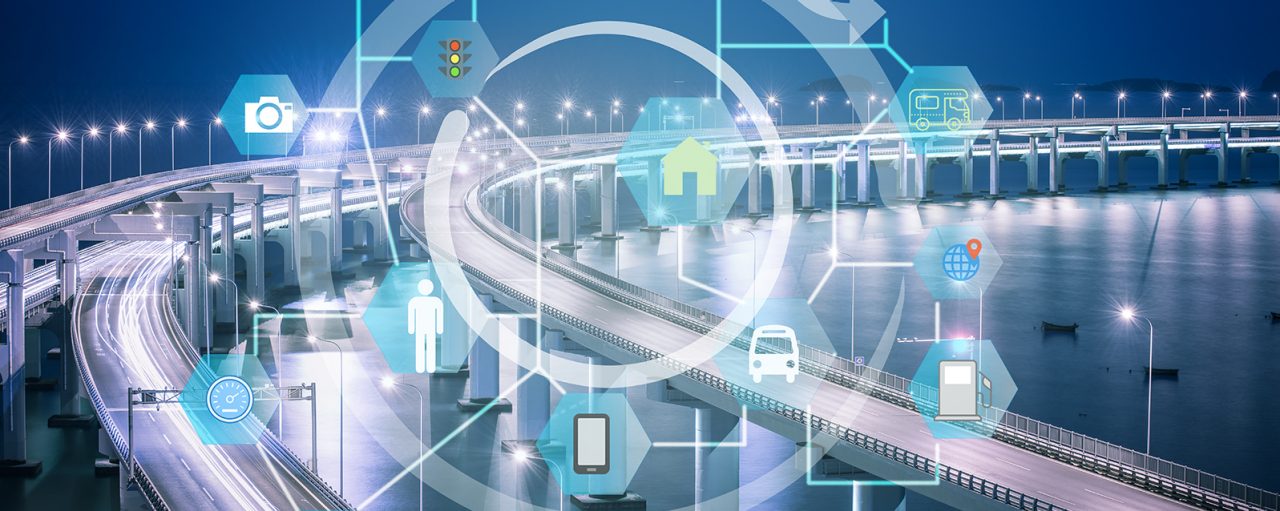 A night scene of an interstate with graphics of many innovation icons on top of the image