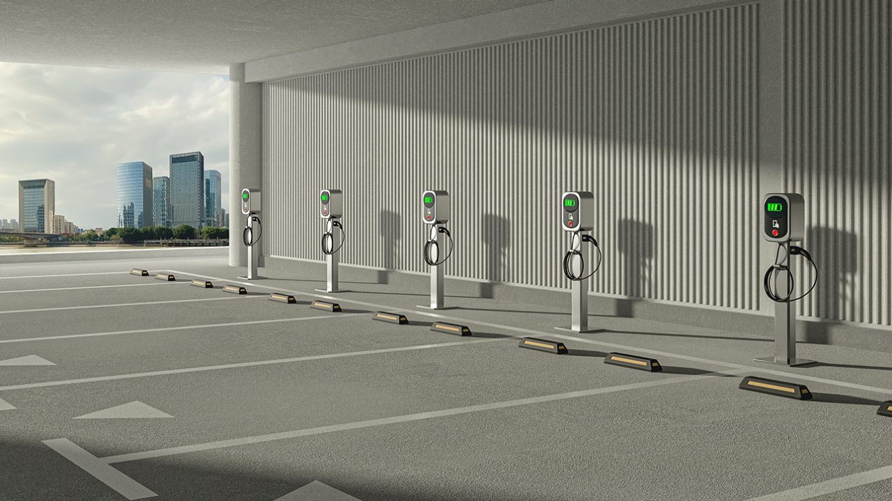 An empty garage with several electric vehicle charging stations