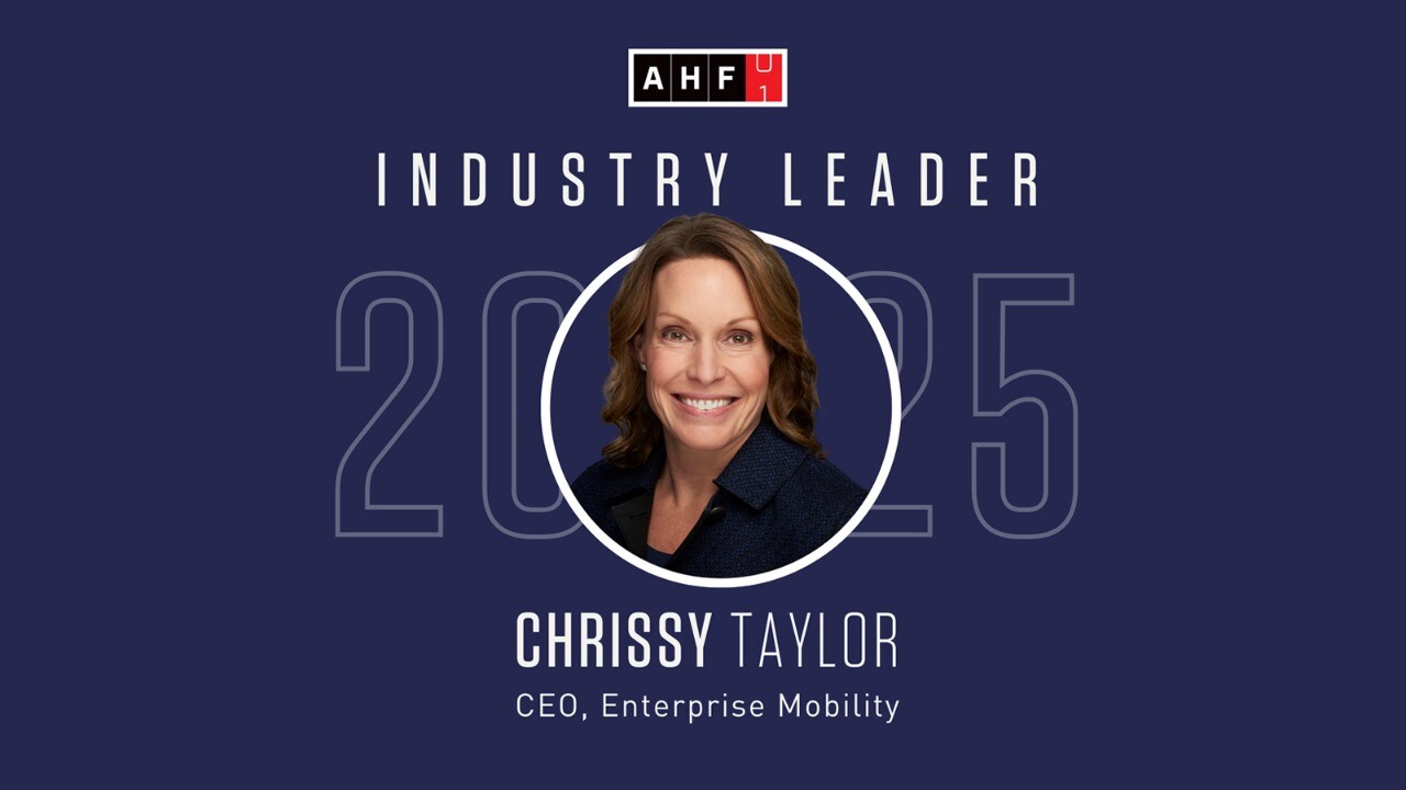 A Chrissy Taylor headshot and graphic on a dark blue background for the Automative Hall of Fame