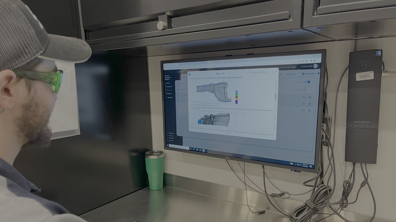 man looking at computer