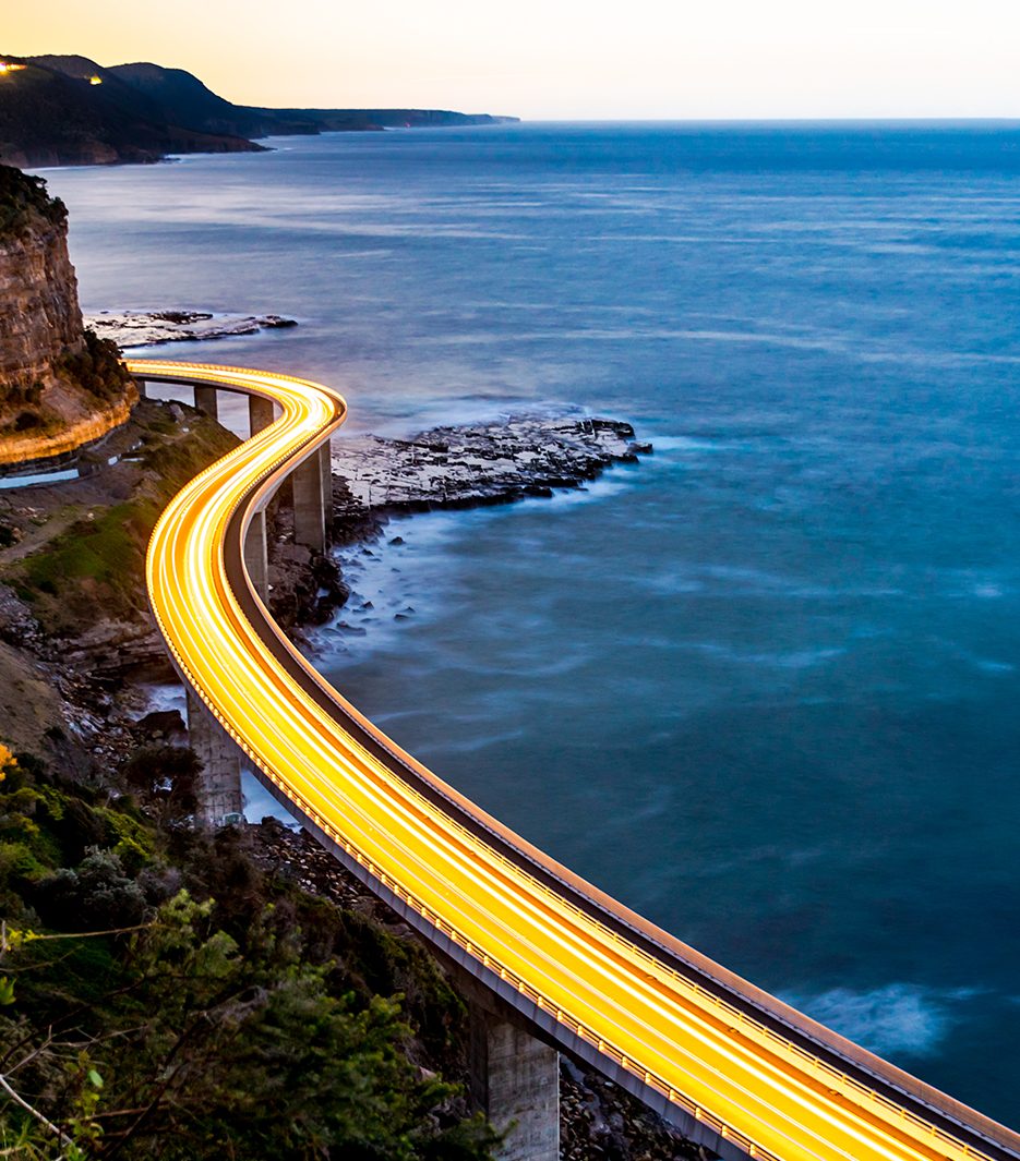 Picture of a road along a body of water